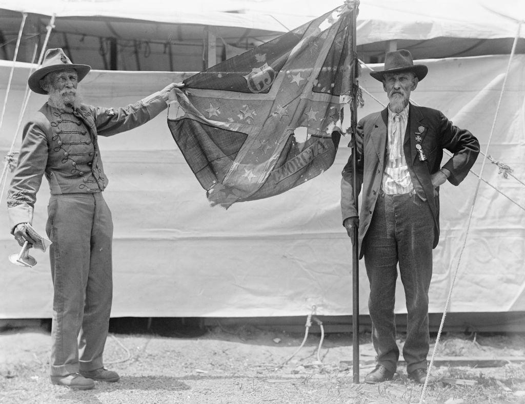 Two Elderly Confederate Veterans Holding Georgia Battle Flag of American Civil War during Confederate Reunion, Washington DC, June 1917.