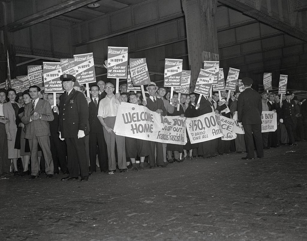 Veterans with Posters and Banners Awaiting American Troops from Spain, 1938.