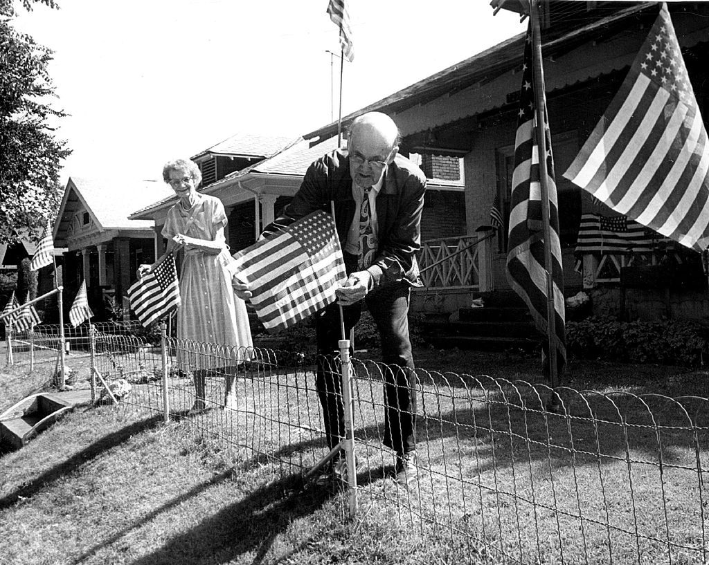 Mr. and Mrs. John B. Fuller, both active in veteran affairs, decked their yard at 1228 Monroe St. again Thursday with American flags.