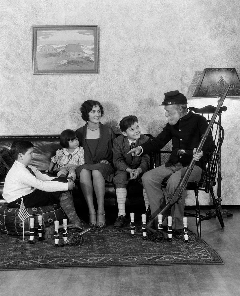 Children listening to grandfather stories of Civil War, 1930s.