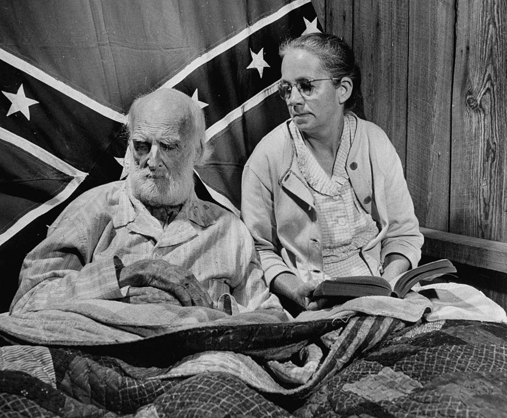 Elderly confederate soldier and veteran Jasper Brown lying in bed.