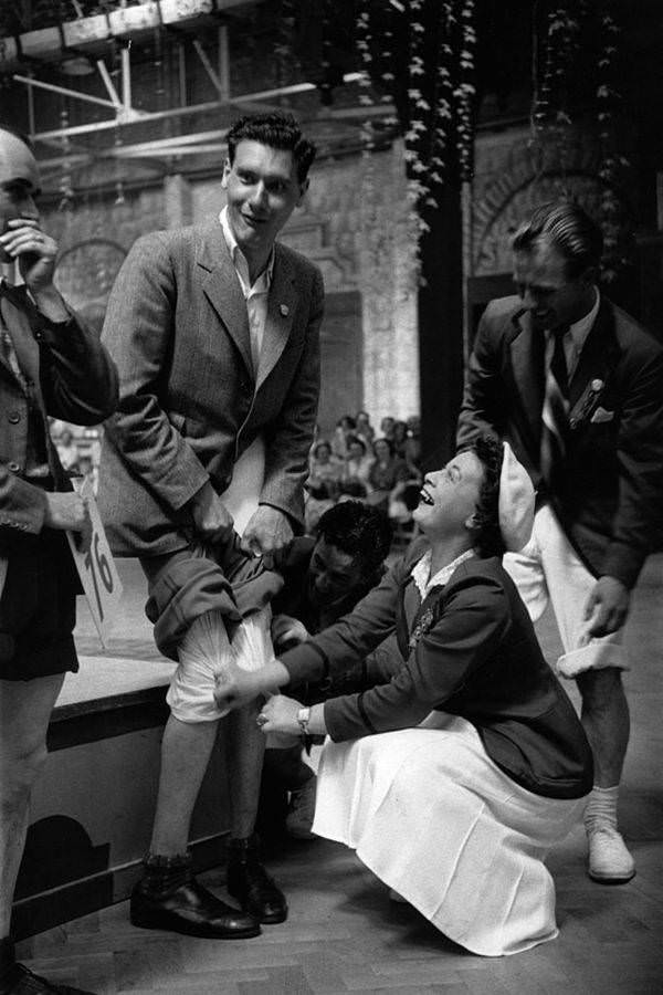 A contestant participates in a knobbly knees competition at Butlin's Holiday Camp in Filey, 1953.