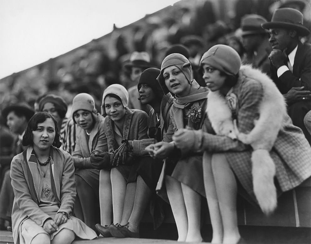 Flappers at outdoor sports event, probably a football game at Griffith Stadium, 1920s.