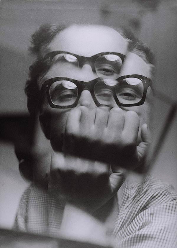 Polish surrealist painter, photographer, and sculptor Zdzisław Beksiński takes a prism selfie, 1956-57.