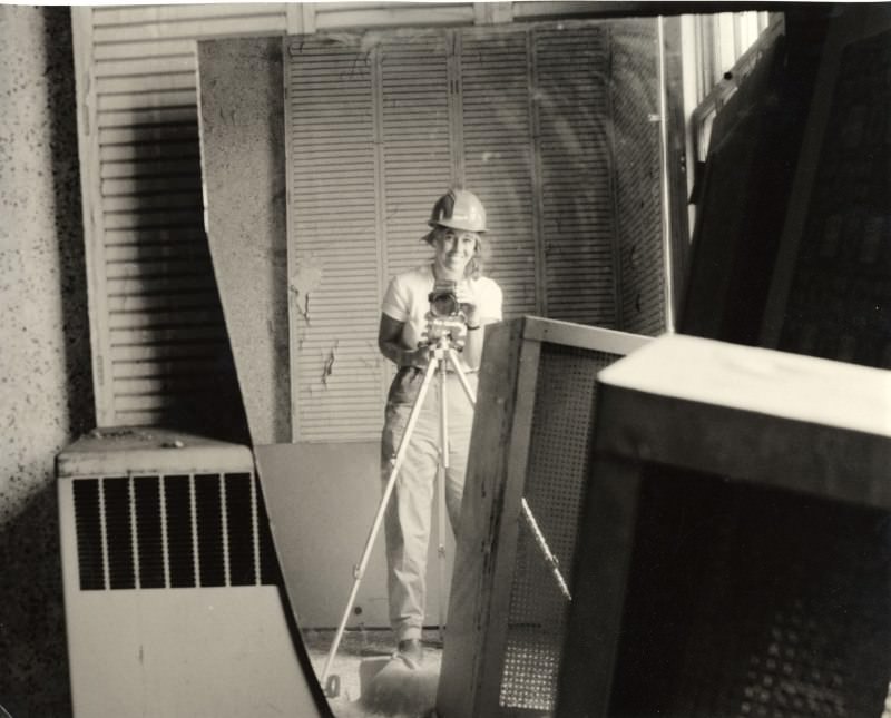 American photographer Carol Highsmith takes a selfie in a broken mirror during the restoration of the Willard Hotel in Washington, D.C., between 1980 and 1990.