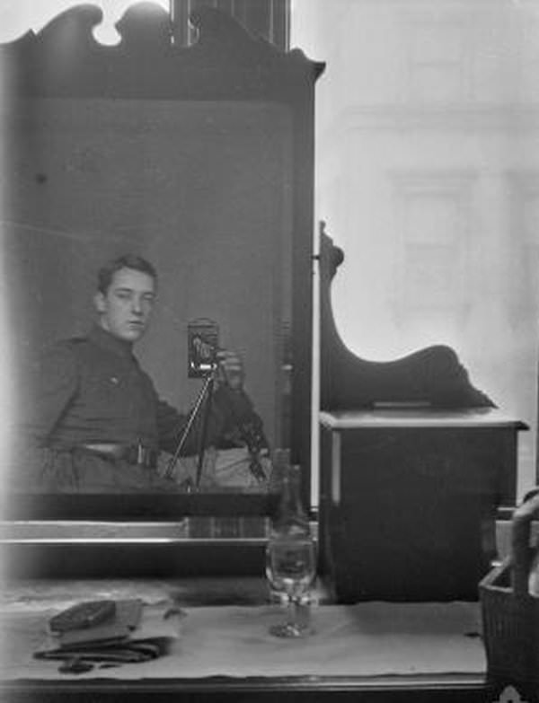 Australian soldier and pilot Thomas Baker takes a dresser mirror selfie, 1917.