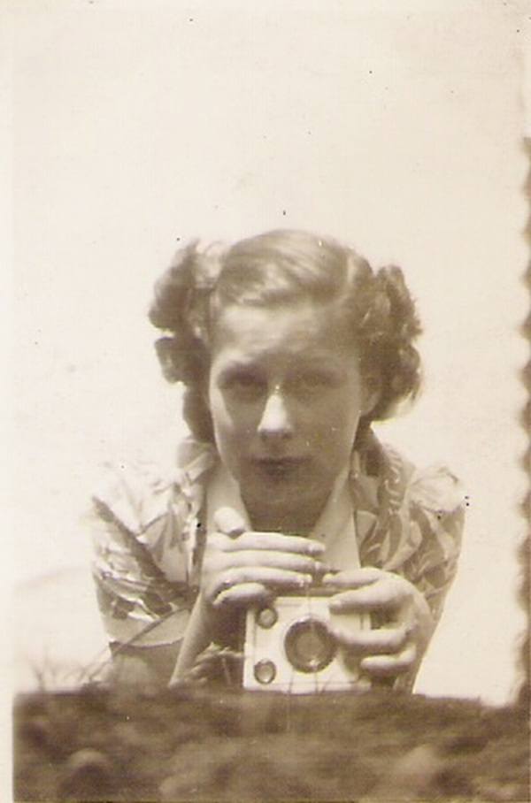 Unidentified woman takes a mirror selfie, 1938.