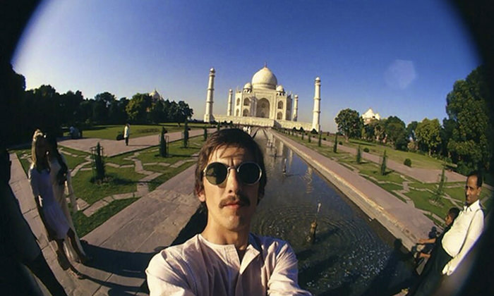 George Harrison taking a selife in front of Taj Mehal in India, 1966.