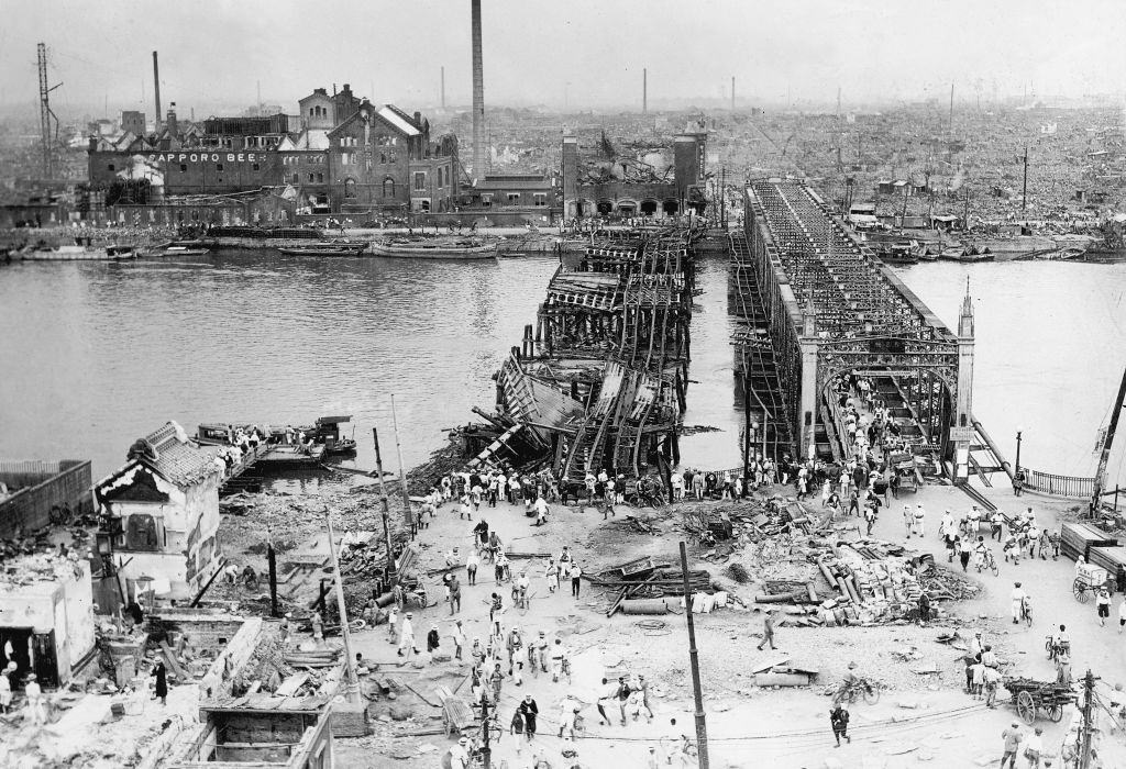 High-angle view of the area around the Azuma Bridge, which crosses the Sumida River, and the Honjo District, 1923.