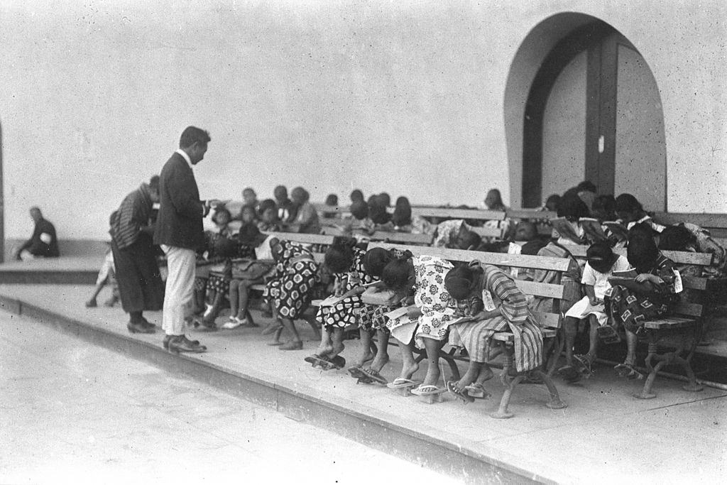 Evacuated children are in class at Hibiya music hall at a temporary housing village in Hibiya Park after the Great Kanto Earthquake.