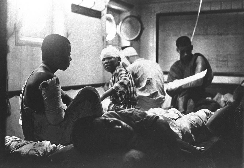 The earthquake survivors receive medical treatment on a ship in harbor at Yokohama Port in September 1923.