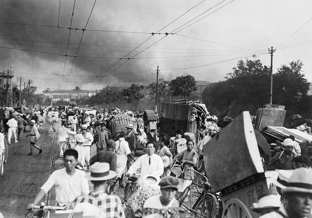 Tokyo residents flee with their belongings after the 1923 earthquake and fire.
