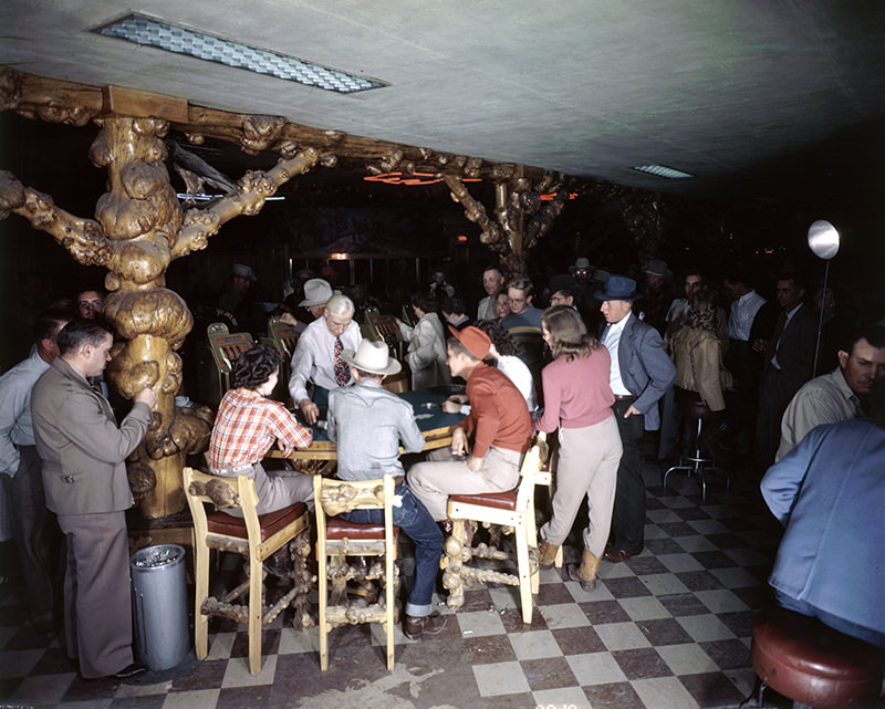 Room full of patrons gambling at The Cowboy Bar. Gambling permitted during tourist season. Jackson Hole, Wyoming, 1948.