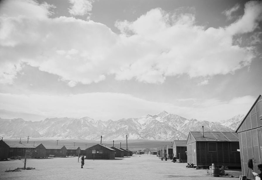 Rows of camp houses at the base of mountains.