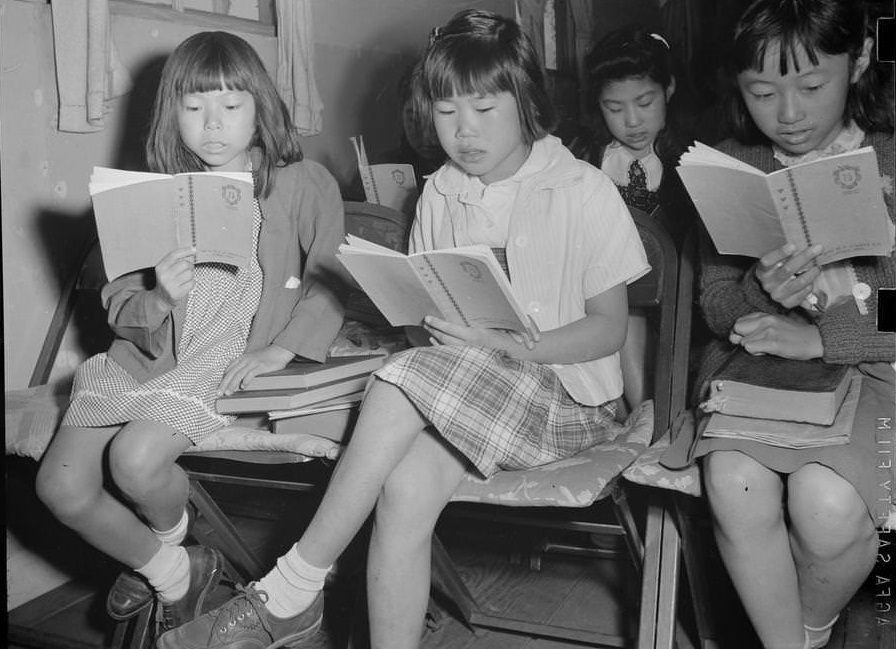 Four girls reading in a Sunday school class.