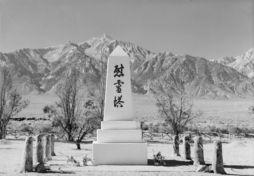 Marble monument with inscription that reads, “Monument for the Pacification of Spirits,” with mountains in the background, including Mt. Williamson.