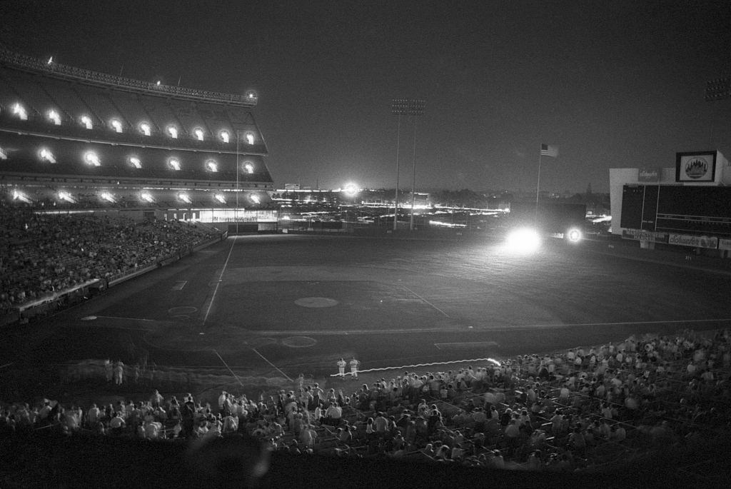 Auxiliary lights, including the headlights from cars in center field, light up Shea Stadium July 13th during the height of the blackout, New York City, July 13, 1977.