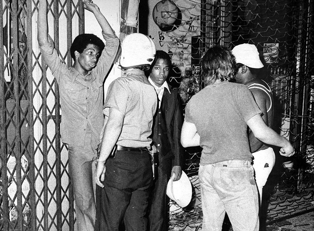 Cops contain suspected looters at Grand Concourse and Fordham Road in the Bronx, New York City, 1977.