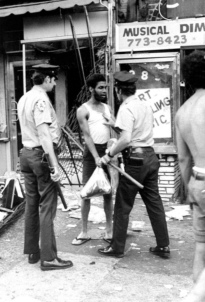 Looter is arrested during 1977 Blackout Power Failure at Utica and Eastern Parkway, New York City, 1977.