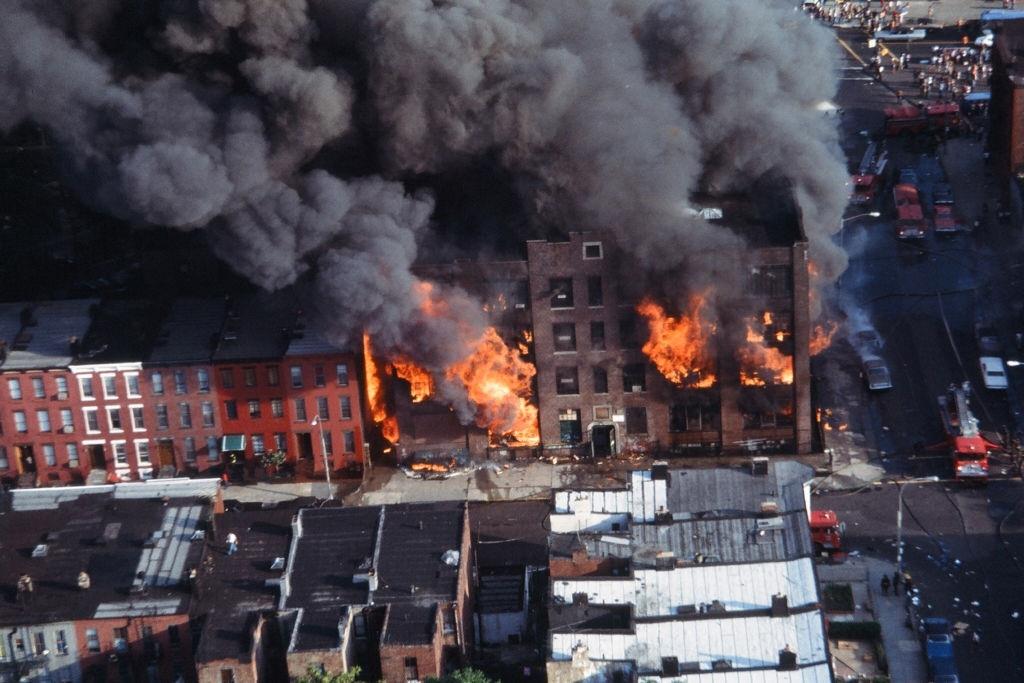 view of a building burning in the wake of the New York City, July 13, 1977.