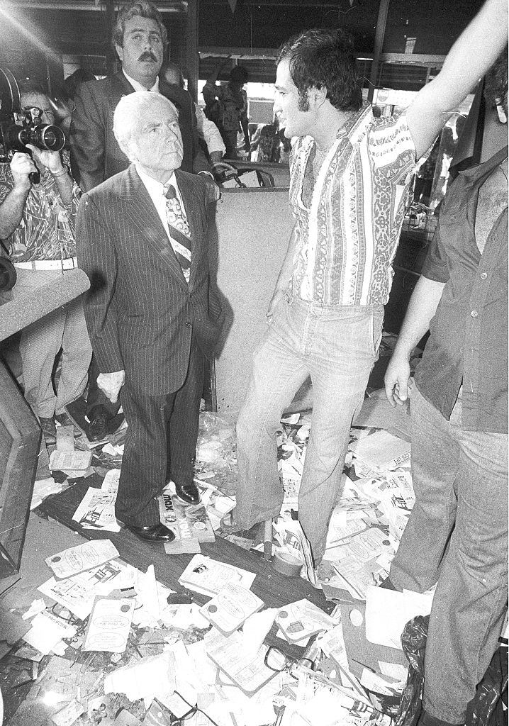 Mayor Abe Beame listens to merchant story on looting after the 1977 blackout power failure at Broadway, New York City, July 13, 1977.