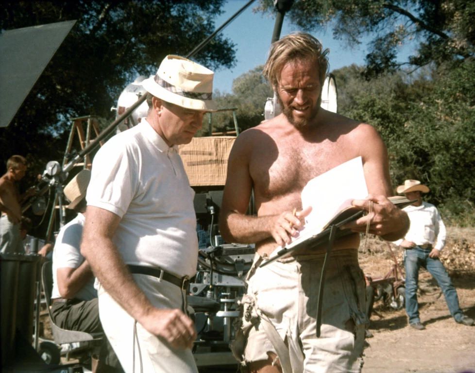 Director Franklin J. Schaffner and Charlton Heston discuss a scene during shooting.