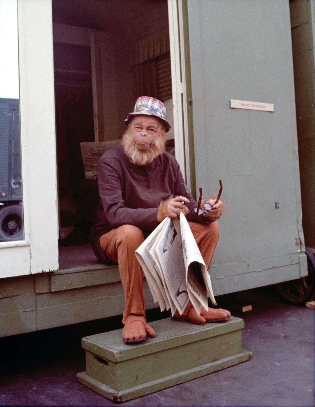 Actor Maurice Evans relaxes (in character) on the set of the film, Planet of the Apes, 1968.