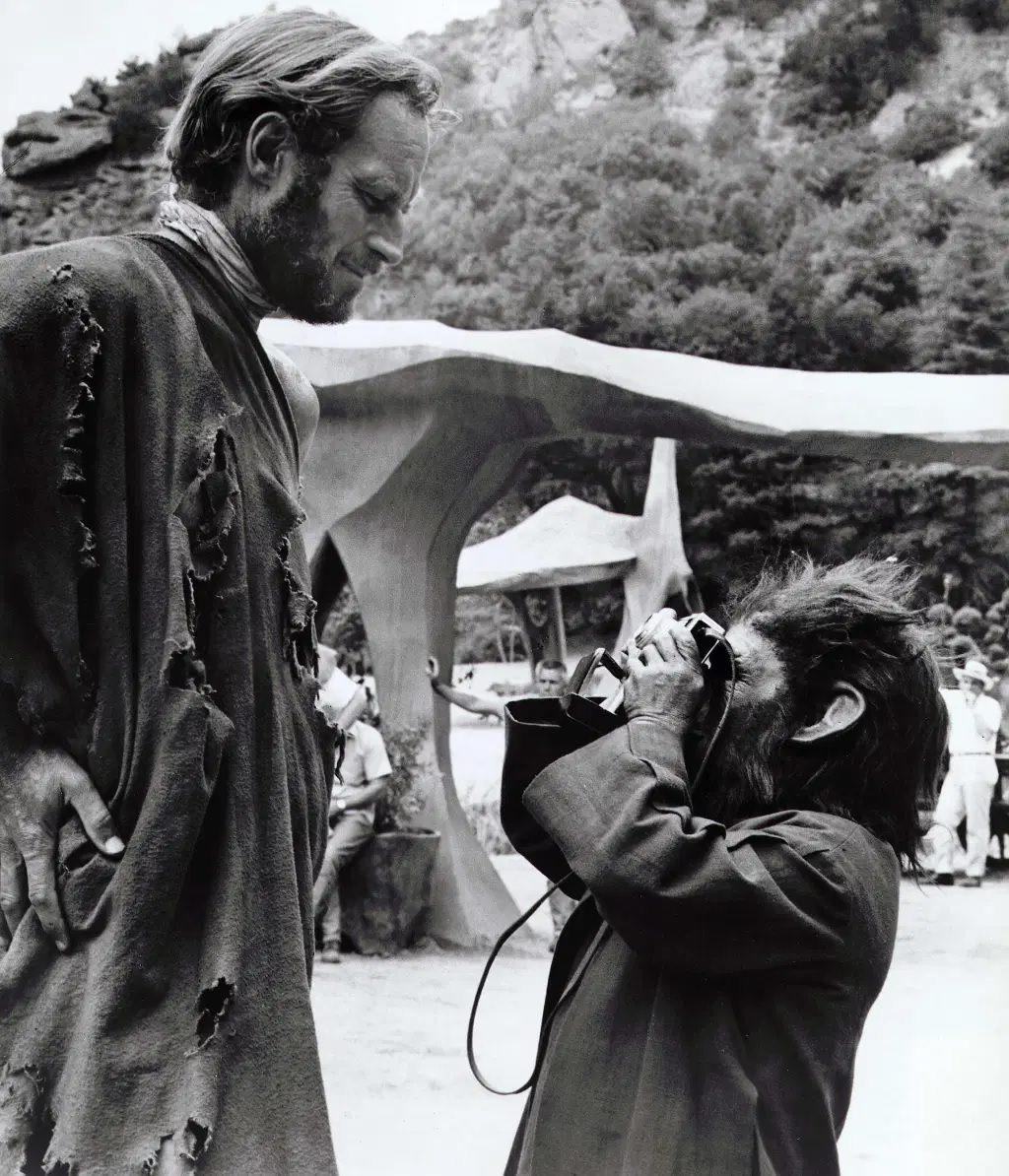 Charlton Heston enjoys time with a fellow cast member.