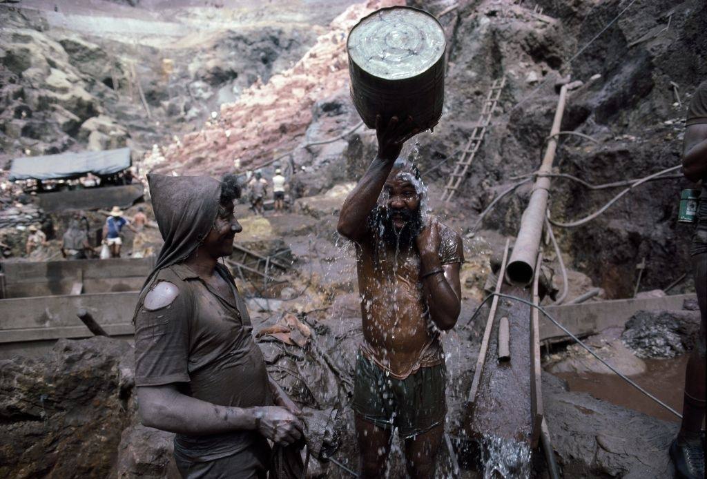 A miner bathe on the edge of an open pit gold mine in Serra Pelada, Brazil.