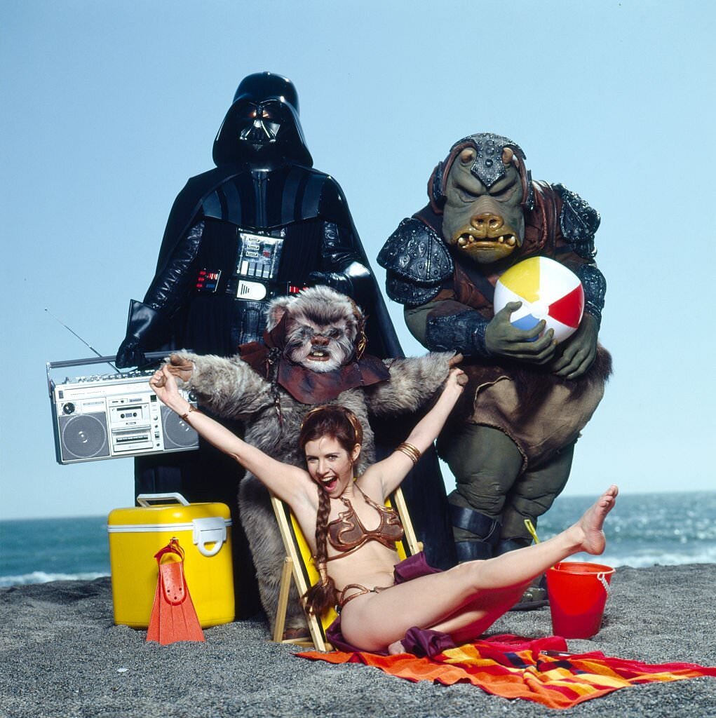 Carrie Fisher on Stinson Beach in Northern California with the cast of Star Wars and boombox, 1983