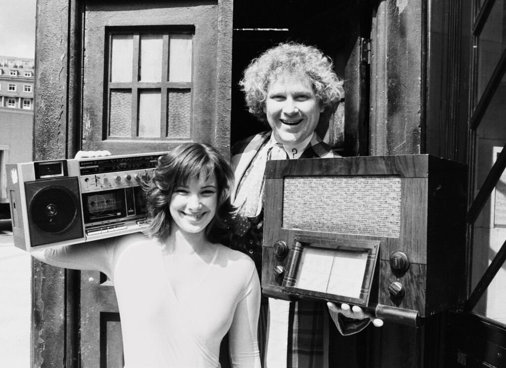Actor Colin Baker with his assistant Nicola Bryant and boombox, 1985