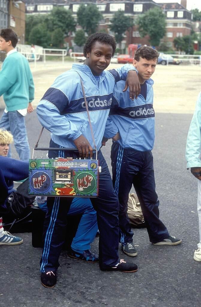 Two friends showing their boombox on the beach at Coney Island, New York City, 1986