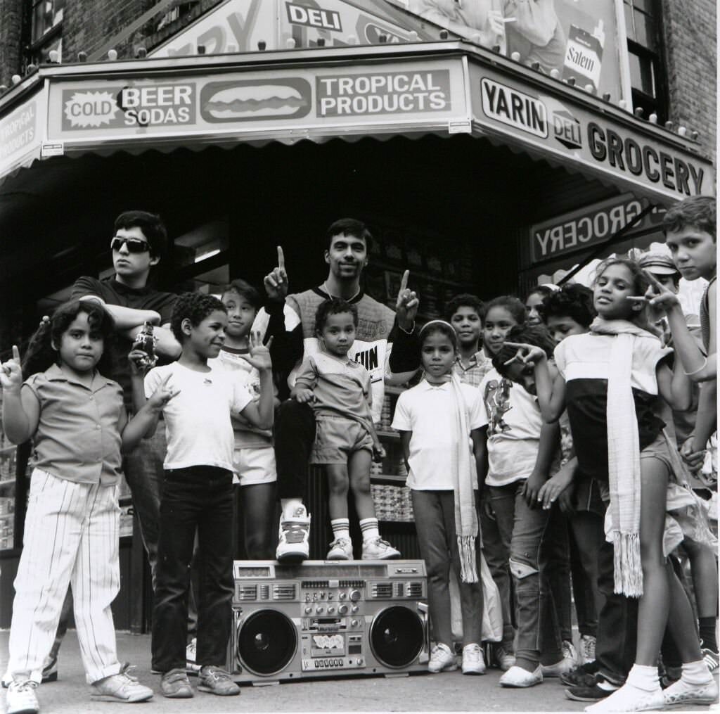 Freshmen poses with his fans outside a Lower East Side deli, 1988.