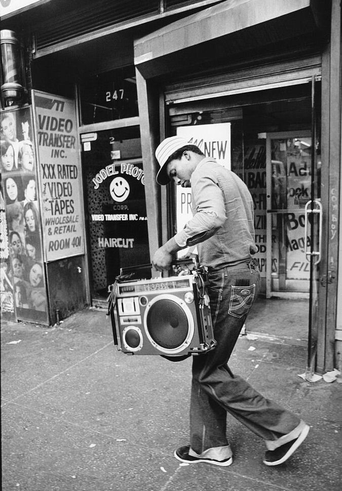 Man walking down the street with his ghetto blaster in his hands, New York, 1980