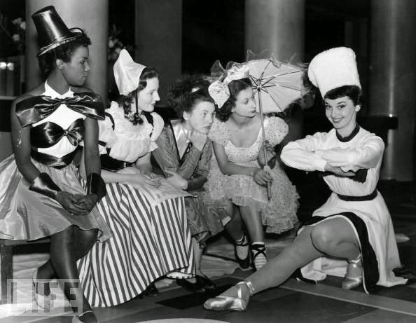 Audrey Hepburn with the cast of a Christmas Party, 1949.