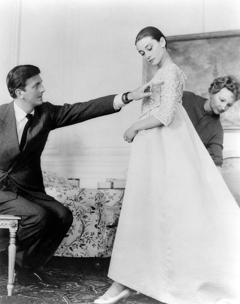 Audrey Hepburn with French fashion designer Hubert de Givenchy in his workshop, in Paris.