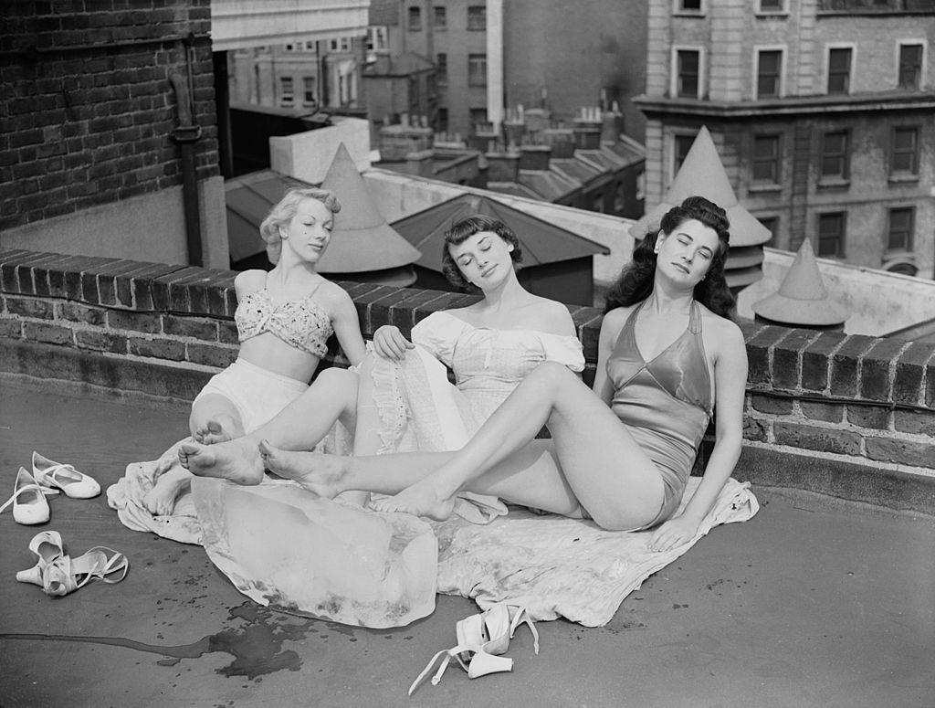 Audrey Hepburn with Aud Johanssen and Enid Smeedon relaxing on the roof of the theatre, 1949.