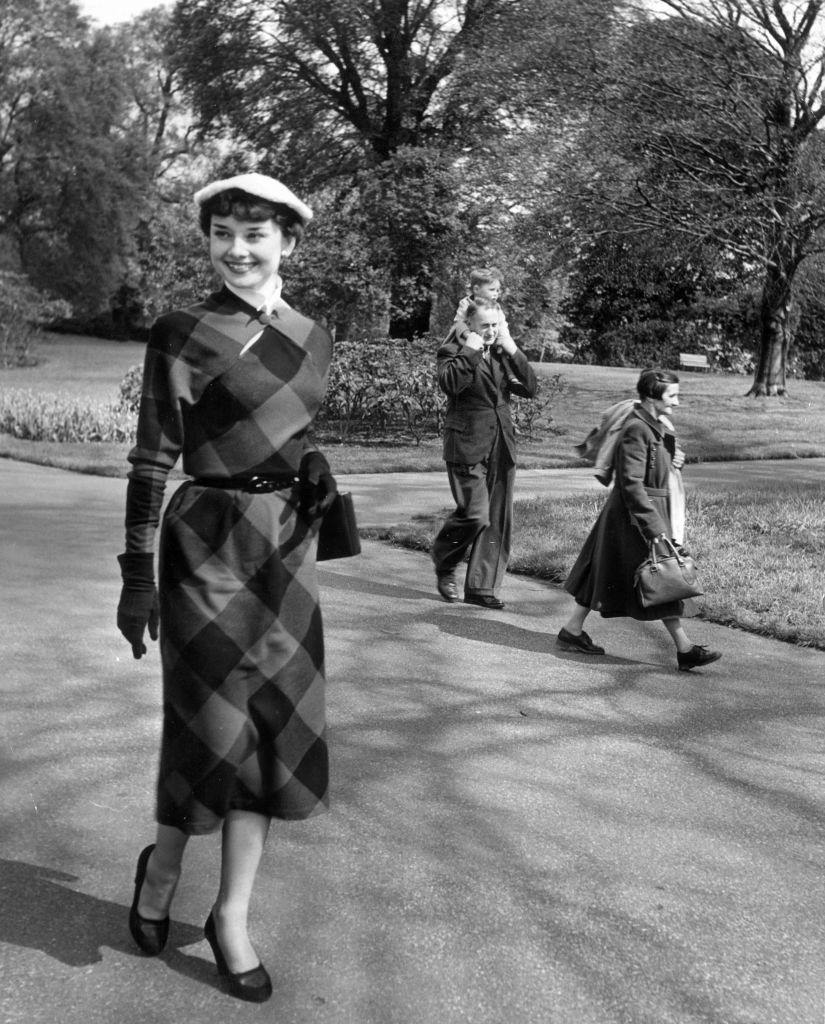Audrey Hepburn takes a stroll through Kew Gardens, May 1950.
