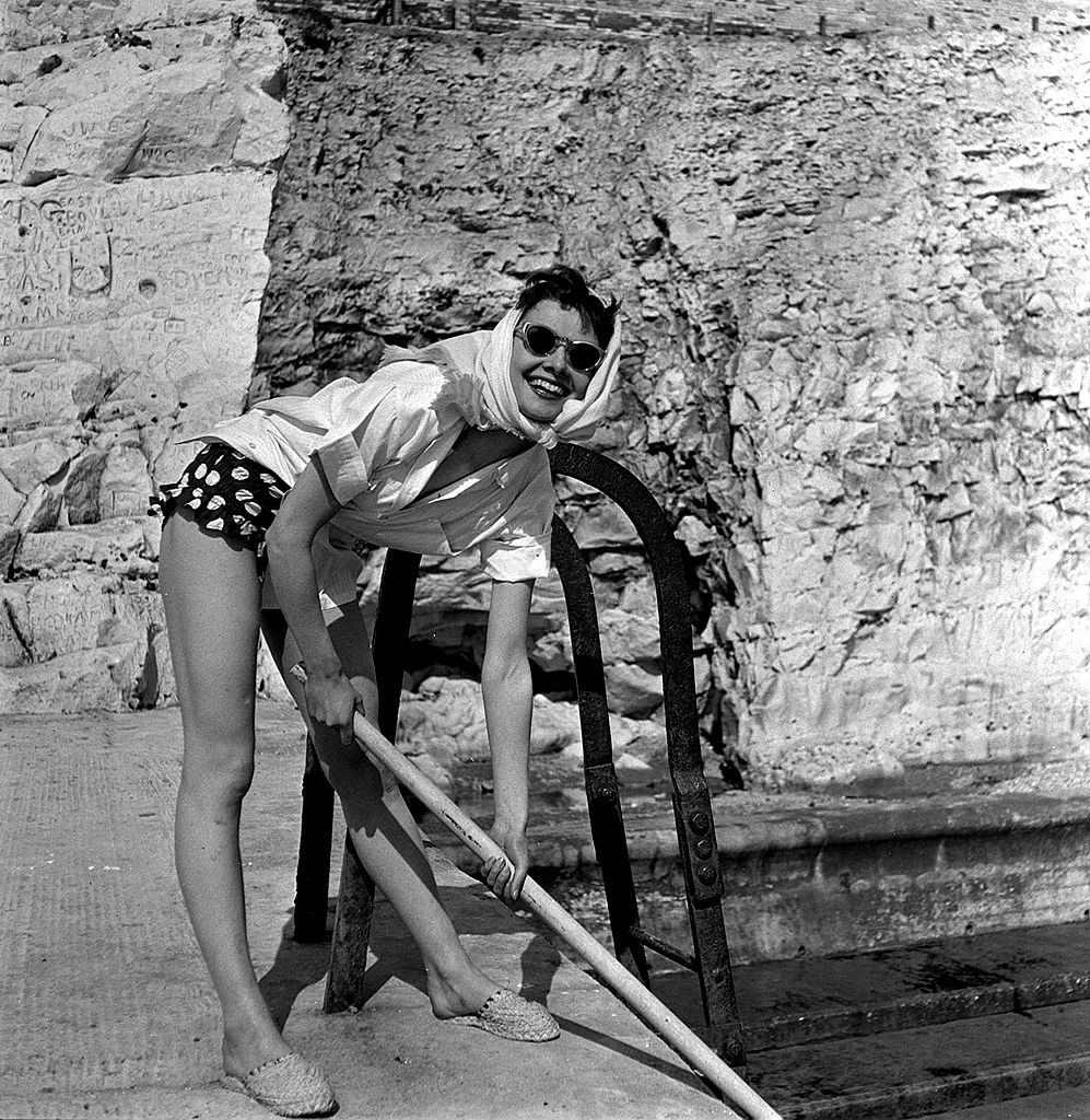 Audrey Hepburn relaxing during a break in filming in Sussex, England, 1951.