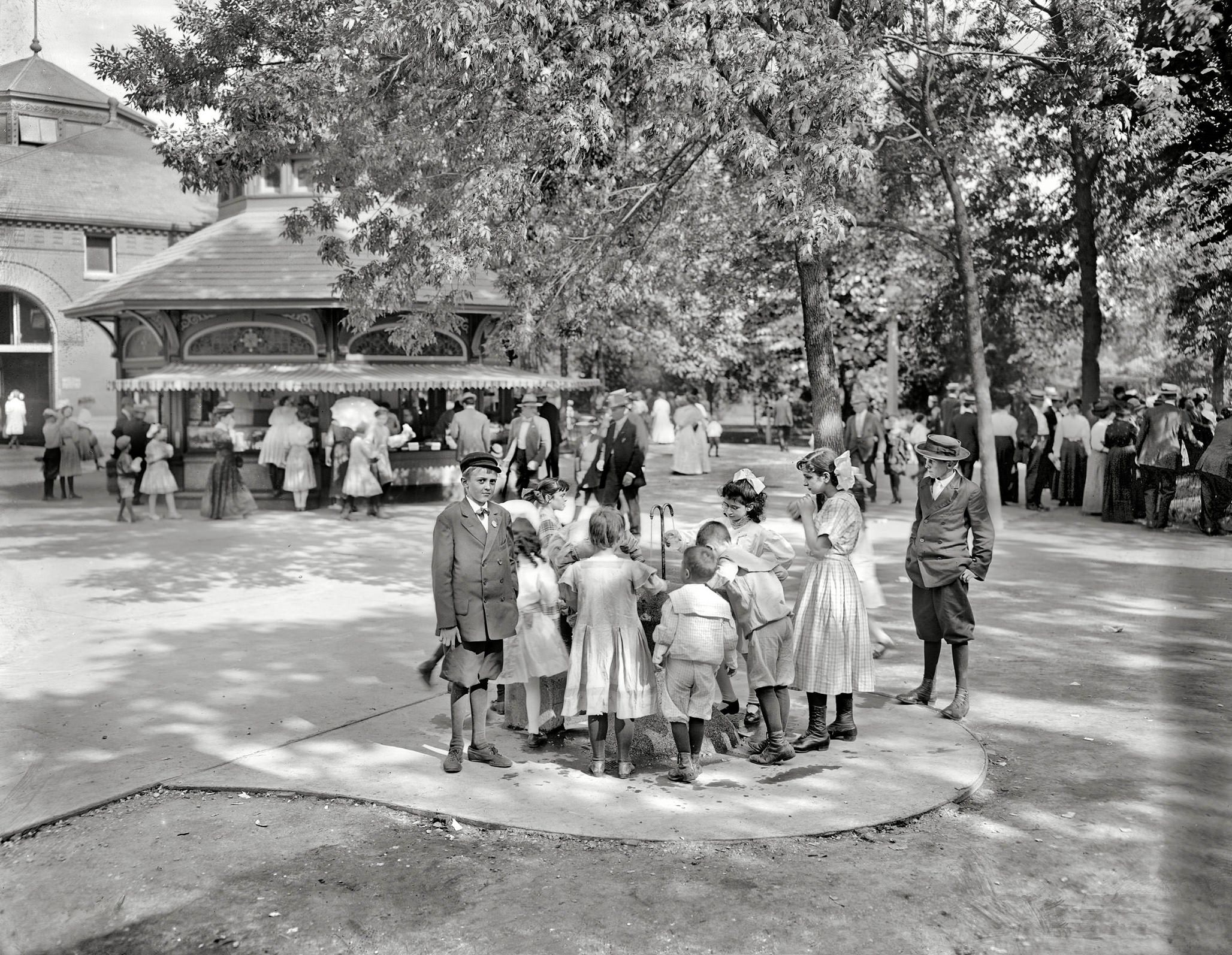 Around a bubbling cup, Lincoln Park, Chicago circa 1910
