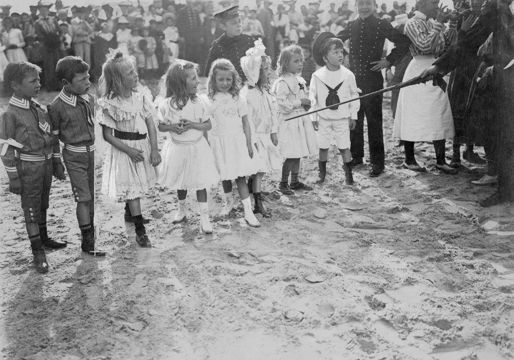 Children at the start of a race at a children's party on the beach of Ostend , 1904.