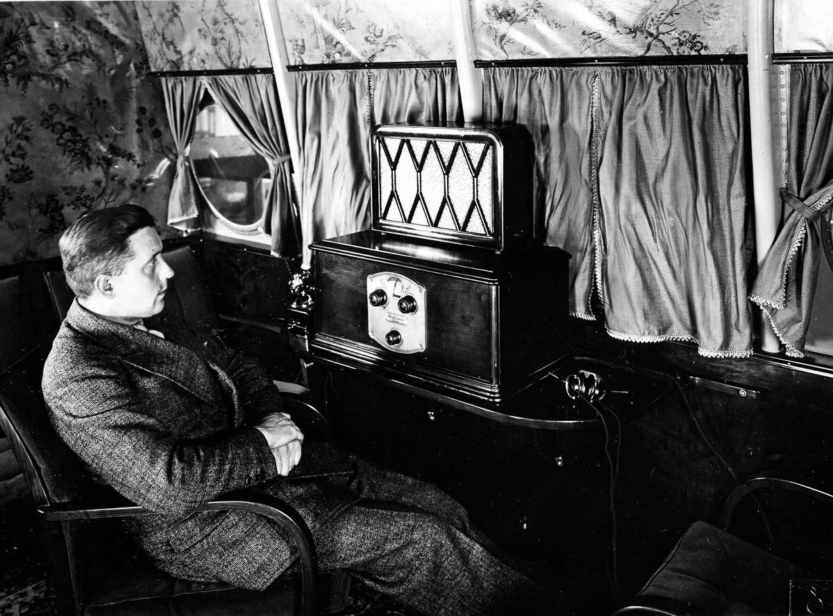 An operator tests the radio reception in the lounge of the flying boat,Sept. 18, 1930