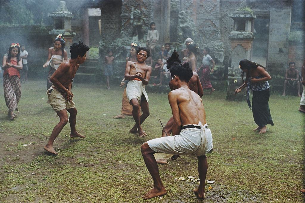 Balinese men in a trance like state perform a ritual dance with knives, 1956.