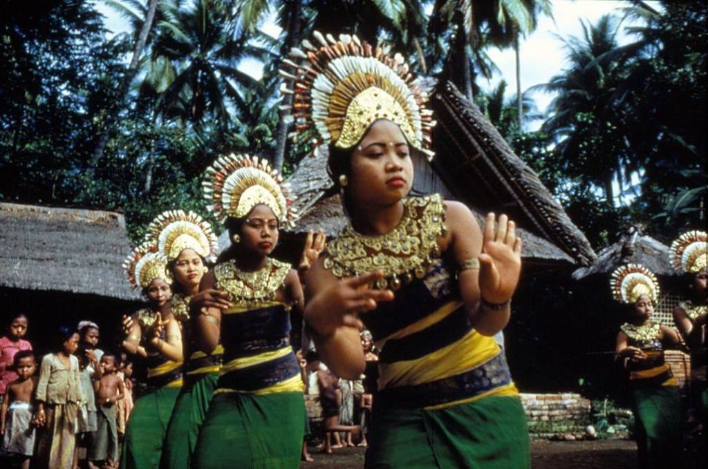 Balinese 'janger' dancers in ceremonial costume with ornate headresses, 1956.