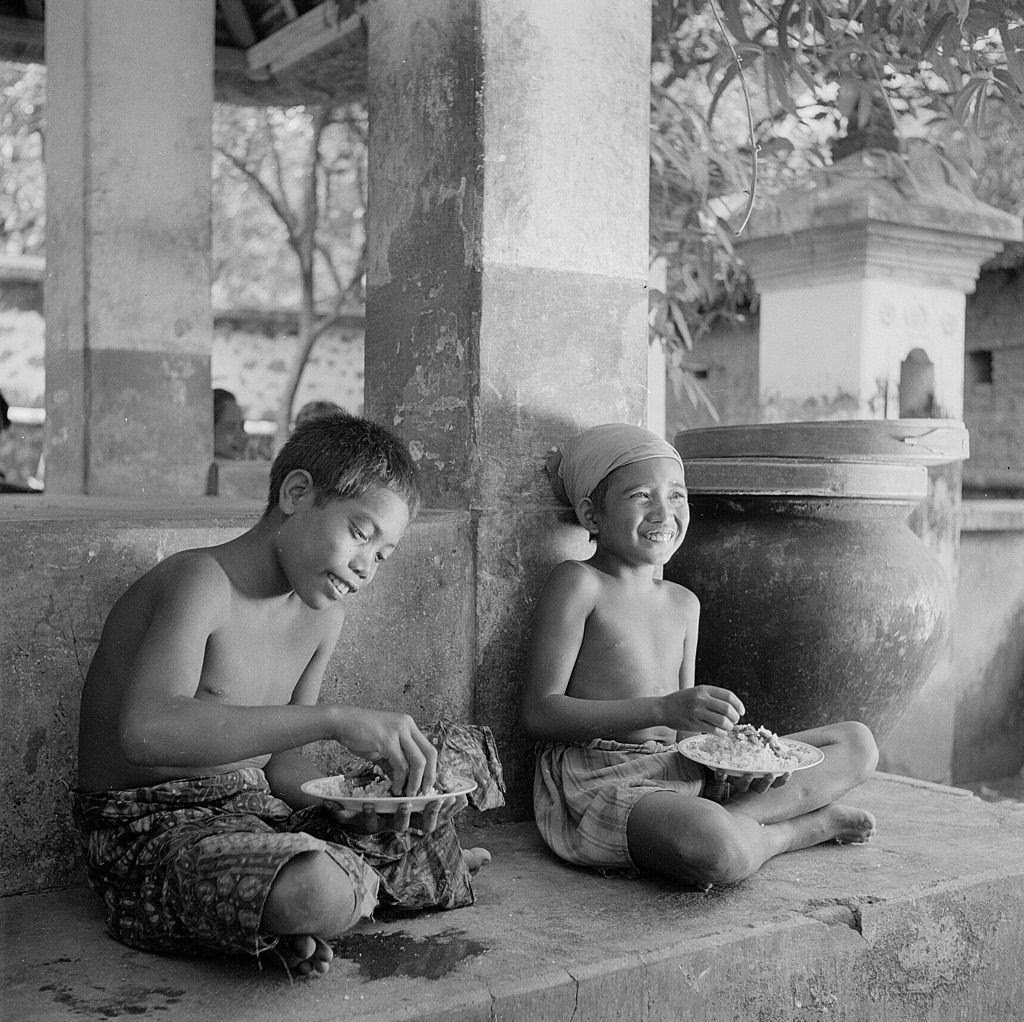 A Balinese boy herding geese, 1955.