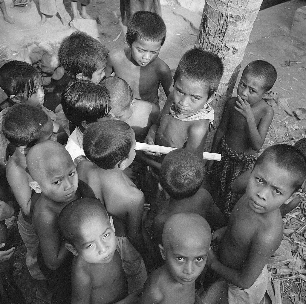 A group of children gather in a Balinese marketplace, 1956.