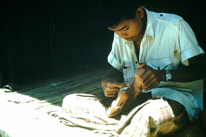 Polishing wood carving, Bali, 1952