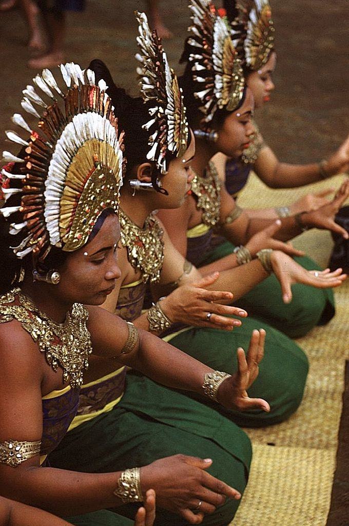 Young Balinese 'janger' dancers in ceremonial costume doing a 'hand dance', 1956.