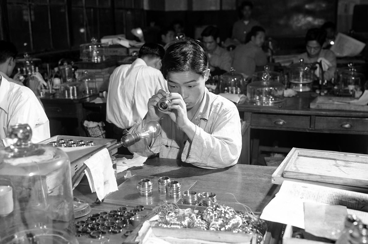 A lens is inspected at Tokyo's Nikon camera plant, on January 5, 1952.