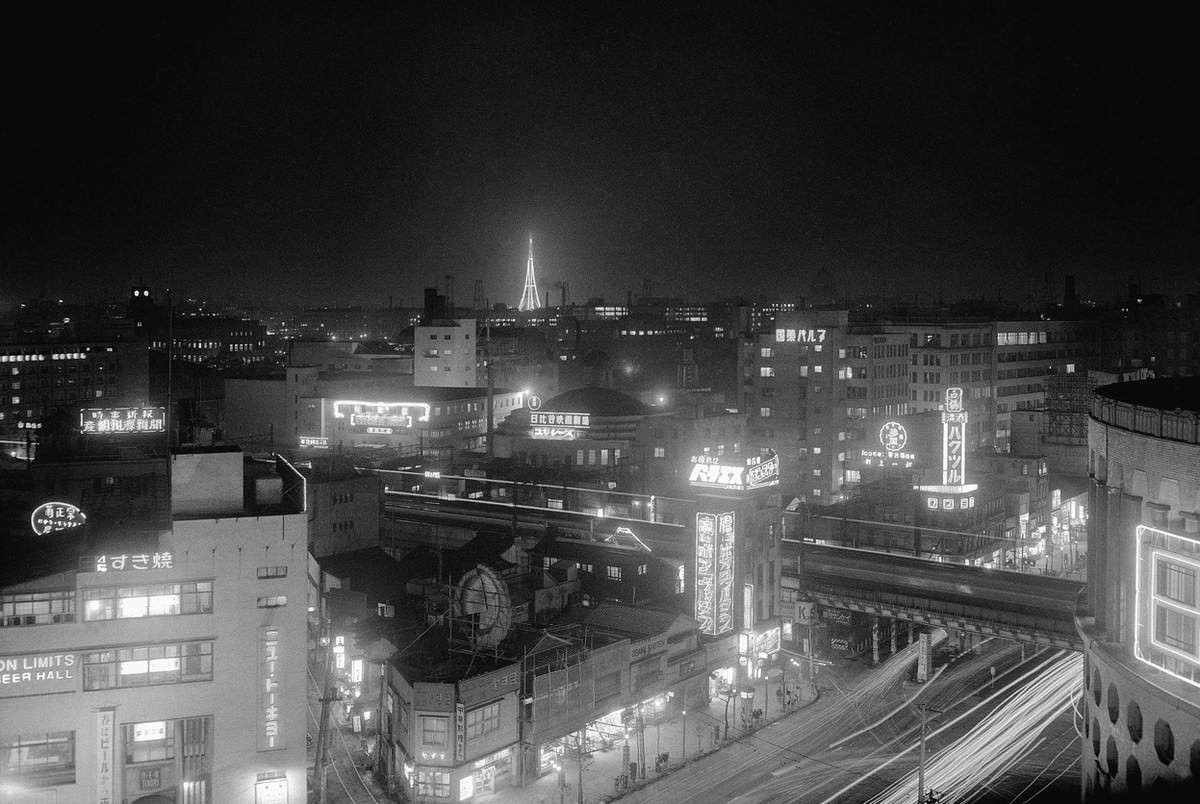 Ten thousand photo flashbulbs lit up a new television station and tower in downtown Tokyo on March 26, 1955, in what was called the biggest flash shot in the world.